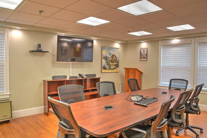 Meeting room with table and chairs at AdCare Rhode Island