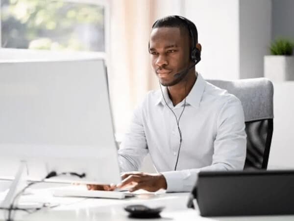 Man sitting at desk working on computer