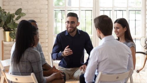 People attending addiction therapy group